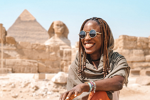 Lady in front of the Sphinx and Pyramids